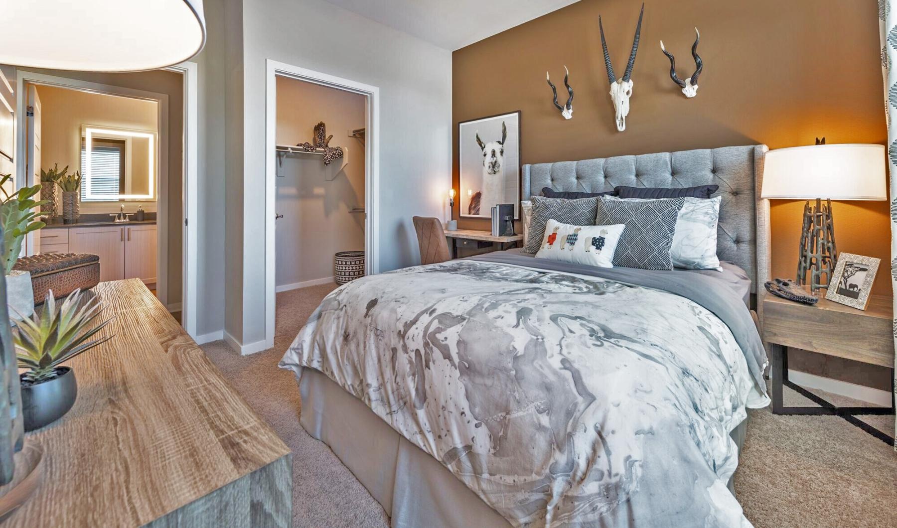 Generous bedroom offerings to fit every family a bedroom with a bed and a table